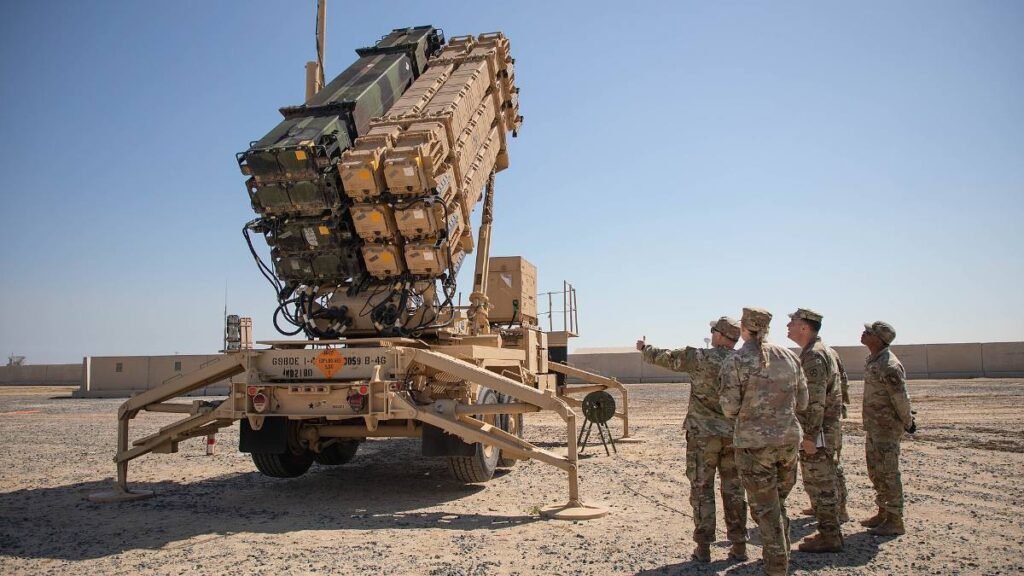 Soldiers with the 1st Battalion, 44th Air Defense Artillery Regiment beside a Patriot launcher