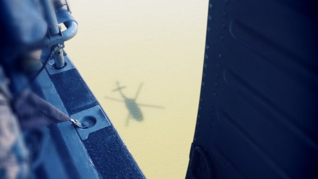 The shadow of a UH-60 Black Hawk helicopter from the 1st Battalion, 224th Aviation Regiment on the Potomac River in Washington, D.C.
