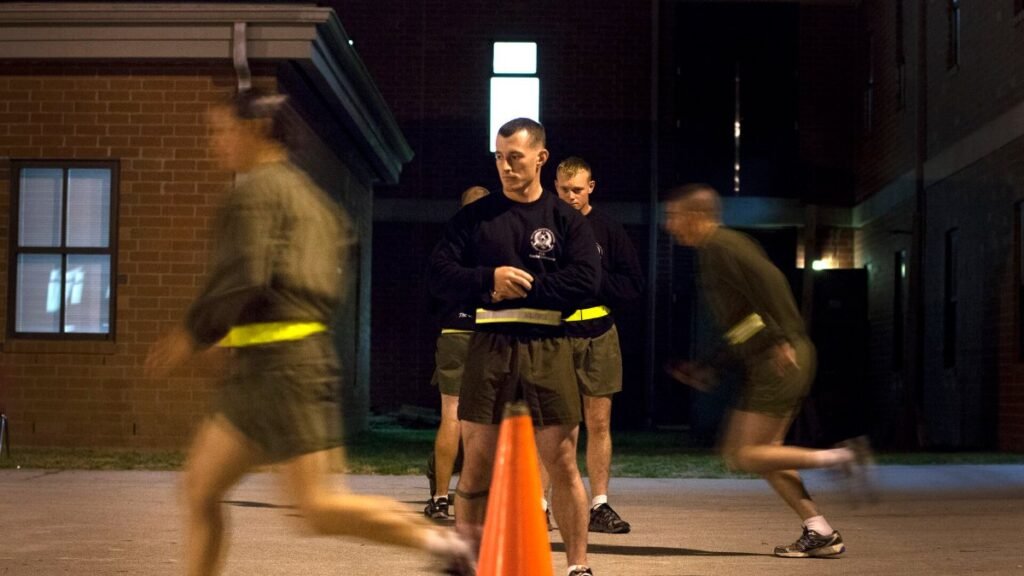 Female Marine student sprints during an infantry training assessment